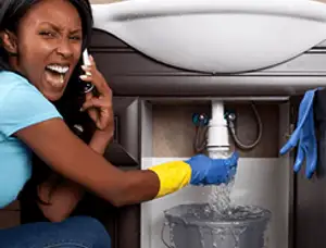 Emergency plumbing repair for a leaking sink drain under a bathroom vanity in Jacksonville, FL