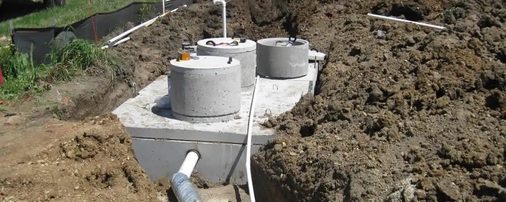 Septic system repair and installation site with tank access ports in Jacksonville, FL