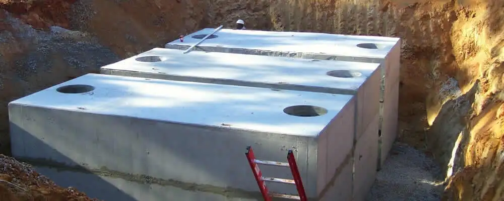 Septic tank installation site with a newly placed concrete tank in Jacksonville, FL